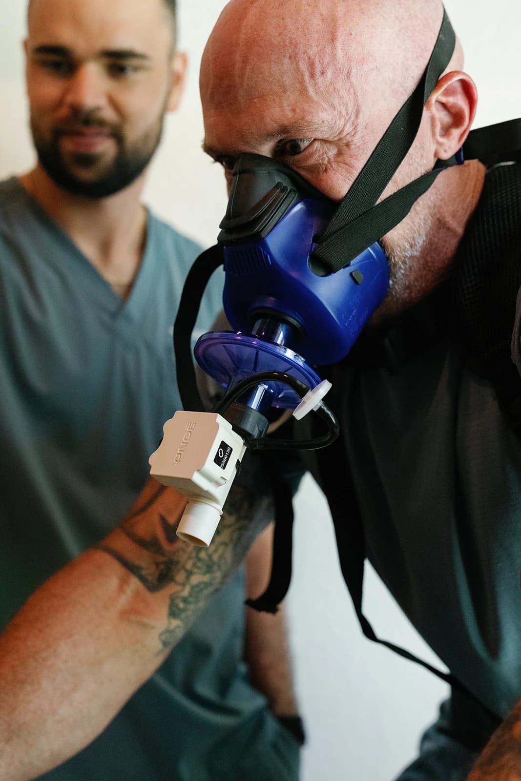 Client wearing a metabolic testing mask at OutRecover in Naples, FL