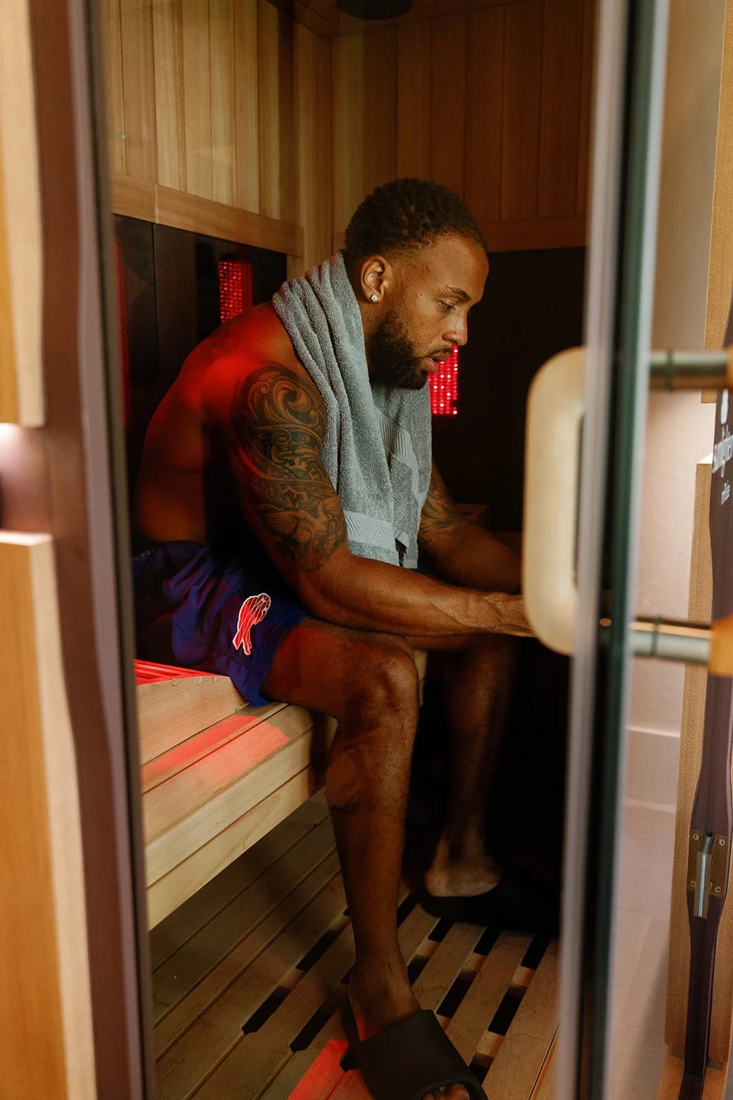 Client in the infrared sauna at OutRecover in Naples, FL